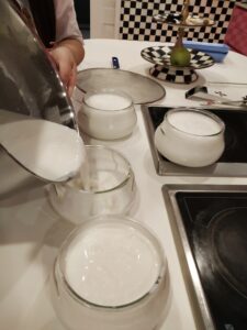 Pour liquid milk into jar