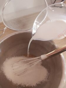 flour and milk into egg